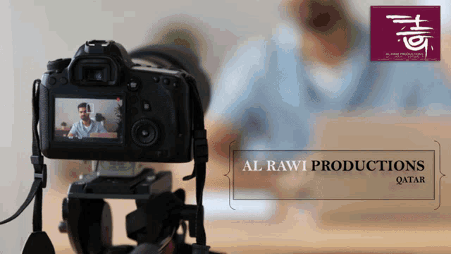 an ad for al rawi productions qatar shows a camera taking a picture of a man