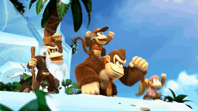 a group of monkeys are standing on a snowy hillside