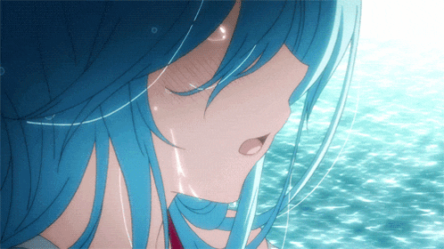 a girl with blue hair is standing in the water