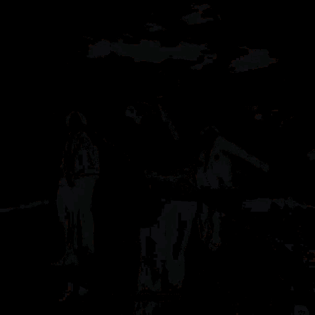 a group of men are dancing in a room with a fire ceiling