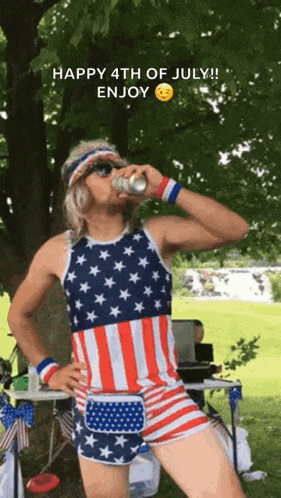 a man in an american flag outfit drinks a beer