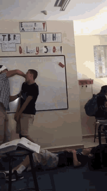 a classroom with a whiteboard that says " bully 3 " on it
