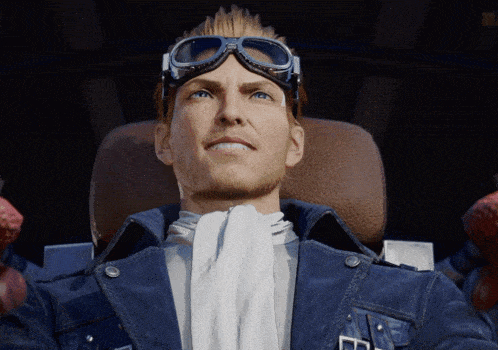 a man wearing goggles and a blue jacket looks up at something
