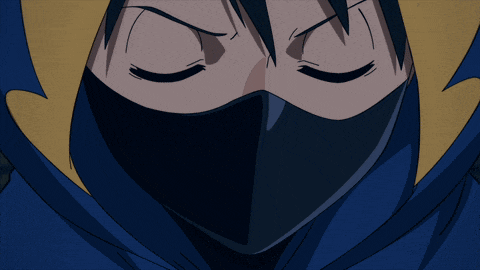 a close up of a person 's face with a black mask on