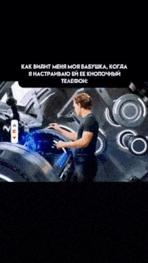a man in a black shirt is working on a machine in a black background
