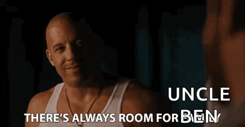 a man in a white tank top is talking to another man with the words " there 's always room for ben " below him