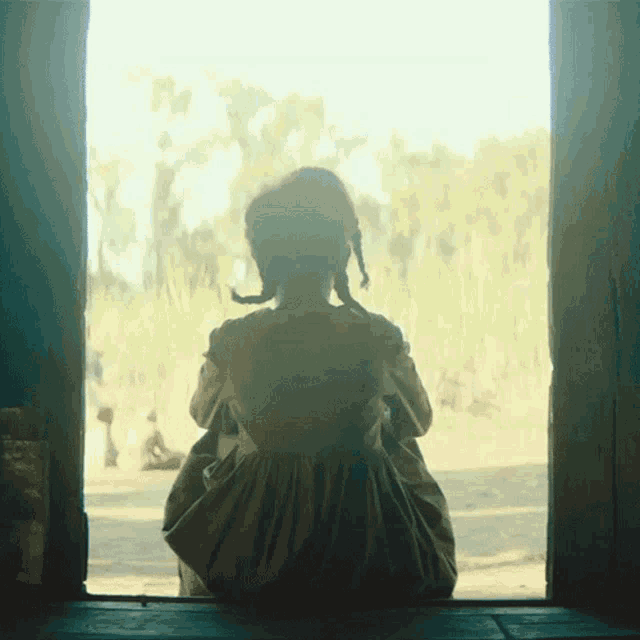 Looking Outside The Underground Railroad GIF - Looking Outside The Underground Railroad Sitting Alone GIFs