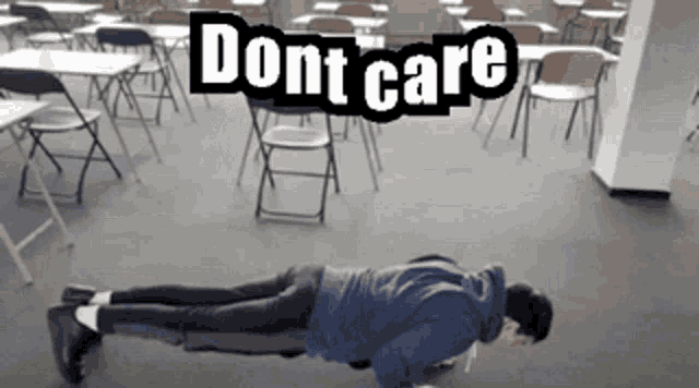 a man is doing push ups in a classroom with the words do n't care behind him