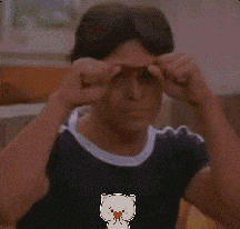 a cartoon cat with a heart in its mouth is behind a man
