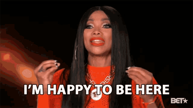 a woman says i 'm happy to be here in a bet advertisement