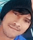 a close up of a man 's face wearing a black hat and smiling .