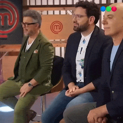 three men sitting in front of a master chef logo