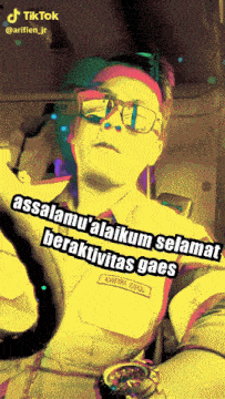 a man wearing sunglasses and a name tag that says arifie