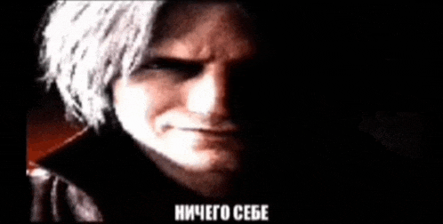 a close up of a man 's face in a dark room with russian writing .