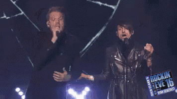 two men singing into microphones on a stage that says rockin ' steve 16