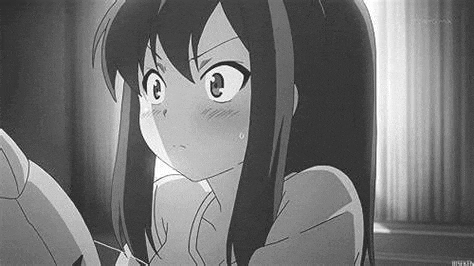 a black and white photo of a girl with long hair looking at the camera .