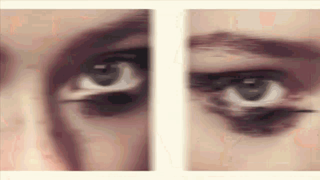 a close up of a woman 's eyes with a blurry effect