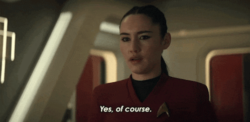 a woman in a red uniform says " yes of course "