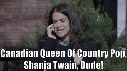 a woman talking on a cell phone with a caption that says canadian queen of country pop shania twain dude
