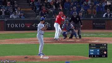 a baseball game is being played in front of a sign for tokio