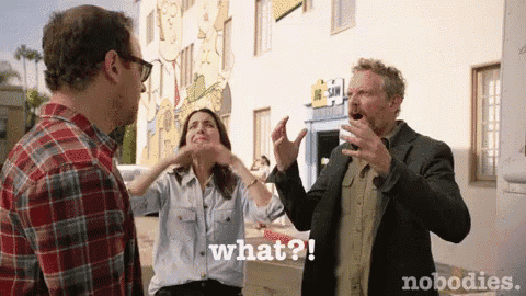 a man and a woman are talking to each other and the man is shouting what ?