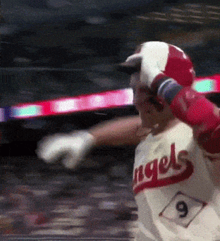 a baseball player wearing a angels jersey with the number 9 on it