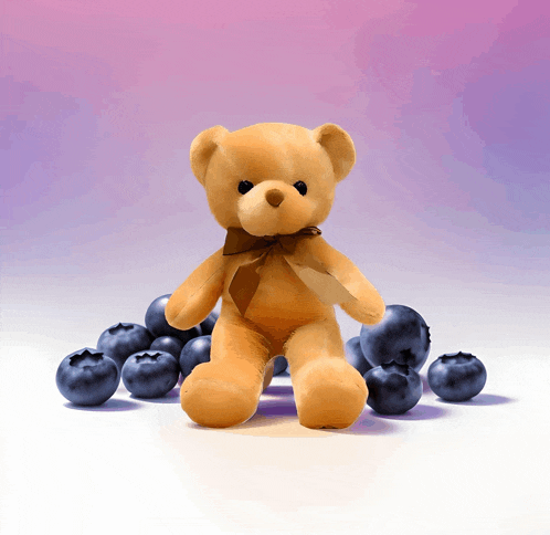 a brown teddy bear is surrounded by blueberries on a white surface