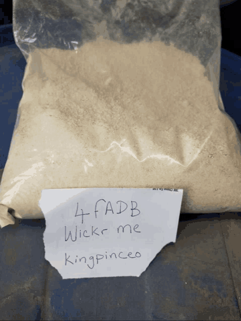 a bag of 4 fadb wickr me kingpinceo sits on a blue surface