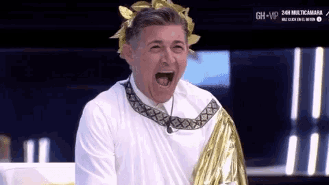 a man dressed as a roman emperor with his mouth open .