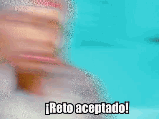 a man with a bandana on his head says " ¡reto aceptado ! "
