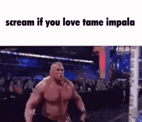 a muscular man is screaming in front of a crowd while standing in a wrestling ring .