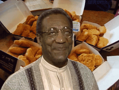 a man is standing in front of boxes of chicken nuggets and a bottle of lunch dressing