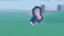 a blurry picture of a person in a video game running in a field .