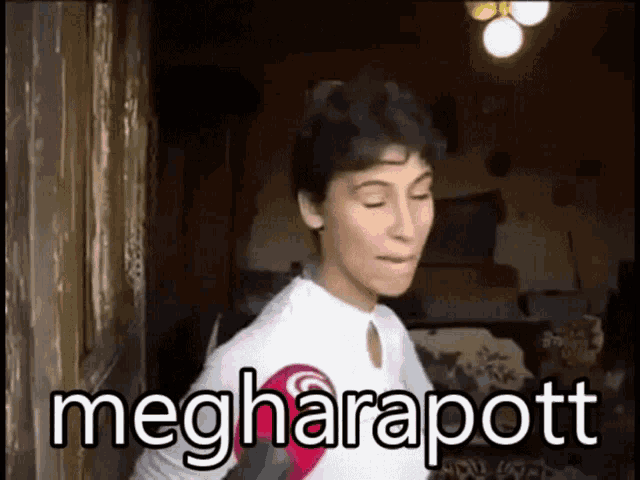 a woman is standing in front of a door with the words megharapott written on the bottom