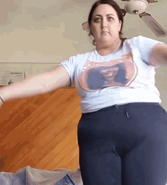 a woman wearing a t-shirt with a picture of a man on it