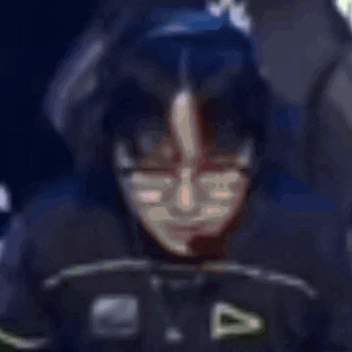 a close up of a joker 's face with a huge smile