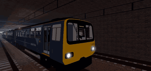 a blue and yellow train is going through a tunnel with a sign on the front that says liverpool