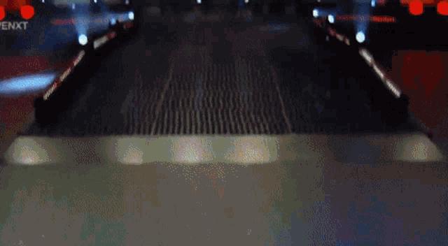 a blurry picture of a stage with a sign that says enxt on it