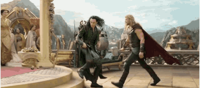 thor and loki are walking together in a scene from a movie .