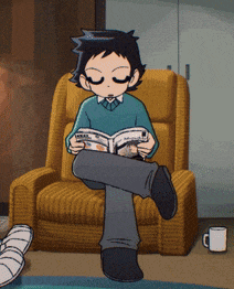 a boy is sitting in a chair reading a magazine