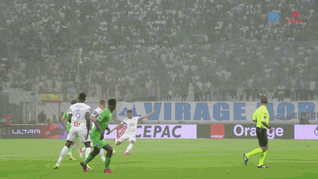 a soccer game is being played in front of a lexus sign
