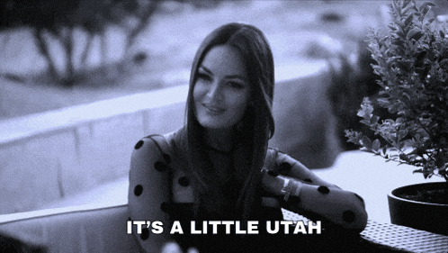 a black and white photo of a woman with the words it 's a little utah