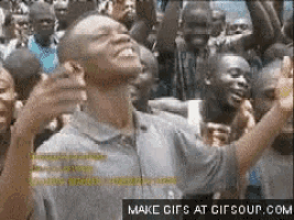 a man in a crowd with a make gifs at gifsoup.com watermark on the bottom