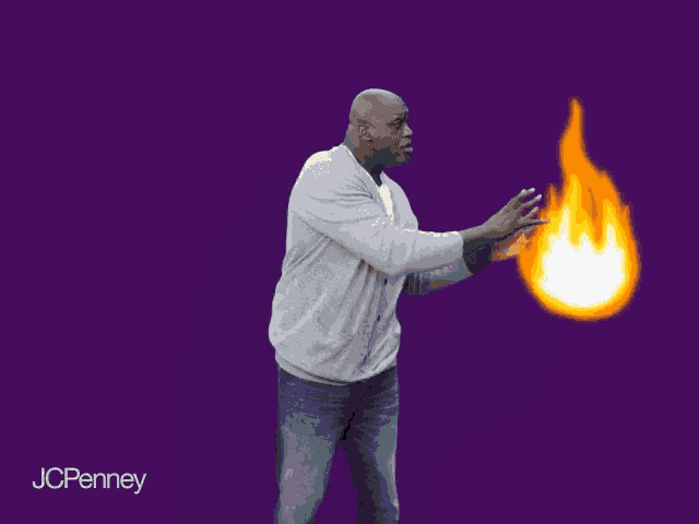 a man is holding a fireball in his hands with jcpenney in the bottom right corner