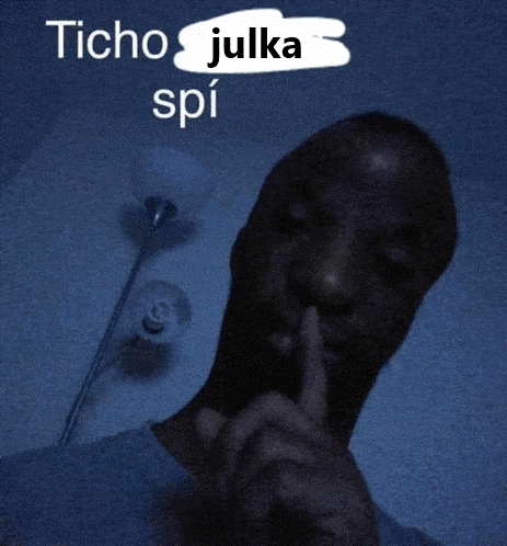 a man holds his finger to his mouth with the words " ticho julka spi " written above him