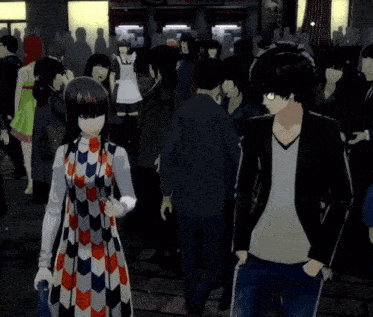 a man and a woman standing in a crowd of people