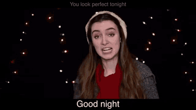 a woman is wearing a hat and scarf and says `` you look perfect tonight good night '' .