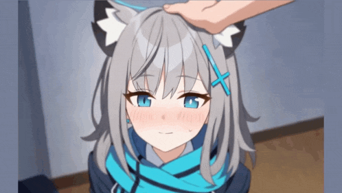 a person is touching a girl 's head with a cat ear