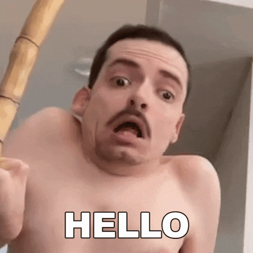 a shirtless man with a mustache is holding a bamboo pole and making a funny face .