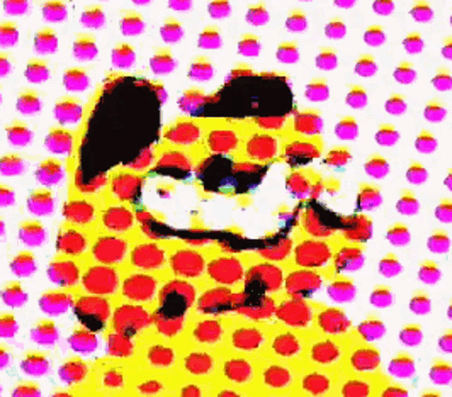 garfield is a yellow dog with red and purple polka dots on it 's fur .